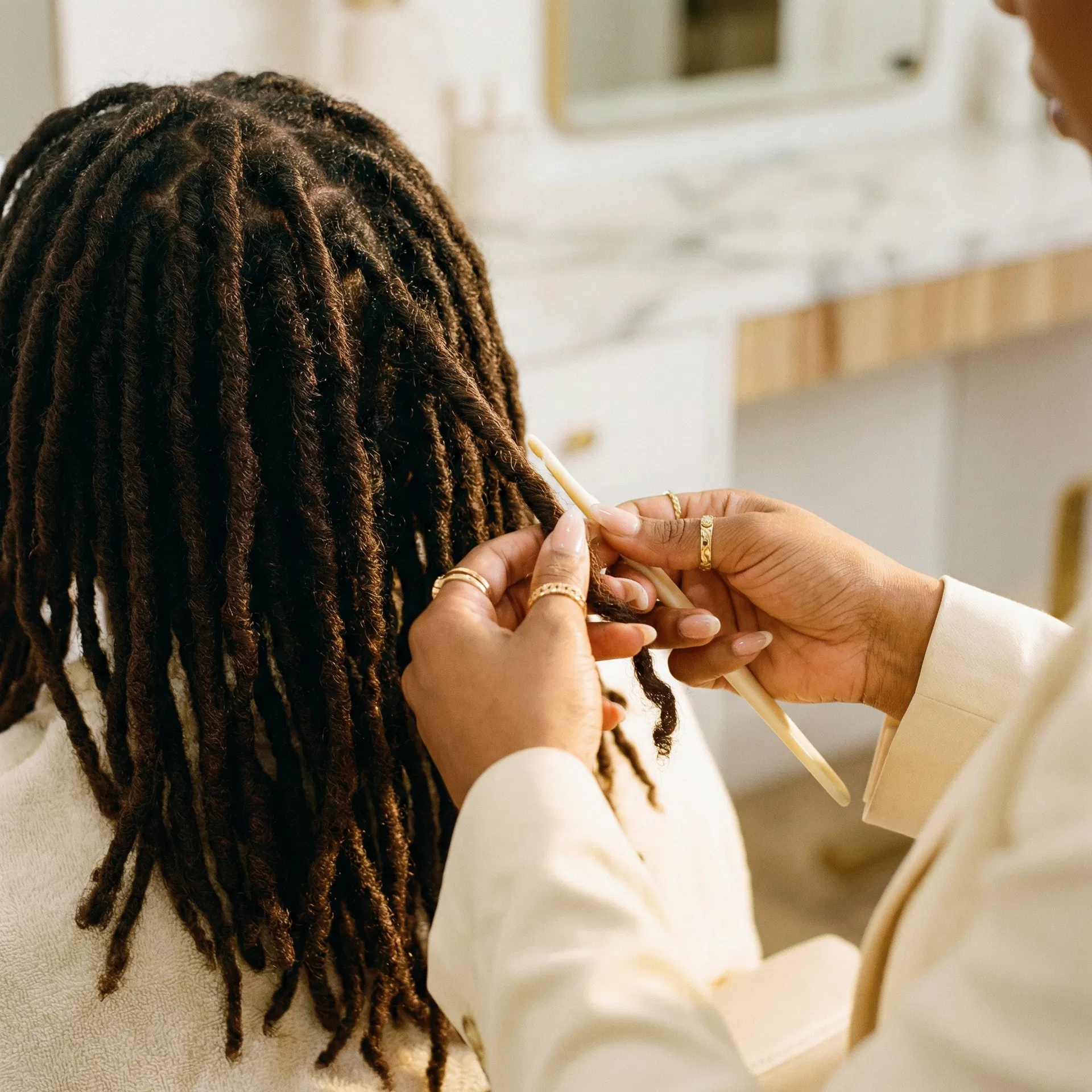 Expert loc styling at Twists & Locs Salon